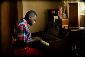 A boy plays the piano