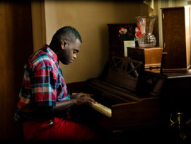 A boy plays the piano